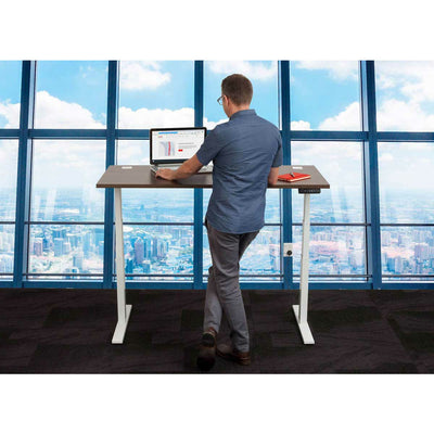 Man at Standing Desk in Front of Window